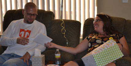 Clint and Jen opening baby shower gifts as fast as we can