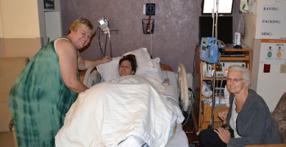 Jen and her Grandma and Mom at her bedside