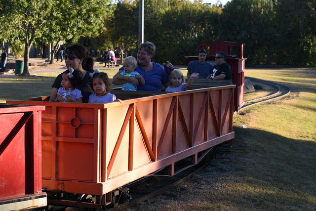 Grandma rides the train with the kids