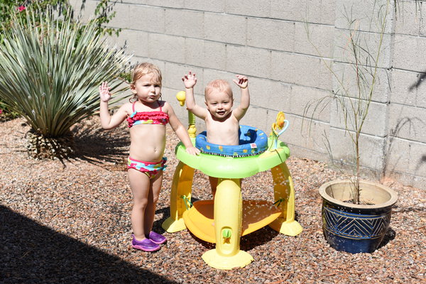 Priya and Remy excited to play in sprinkler