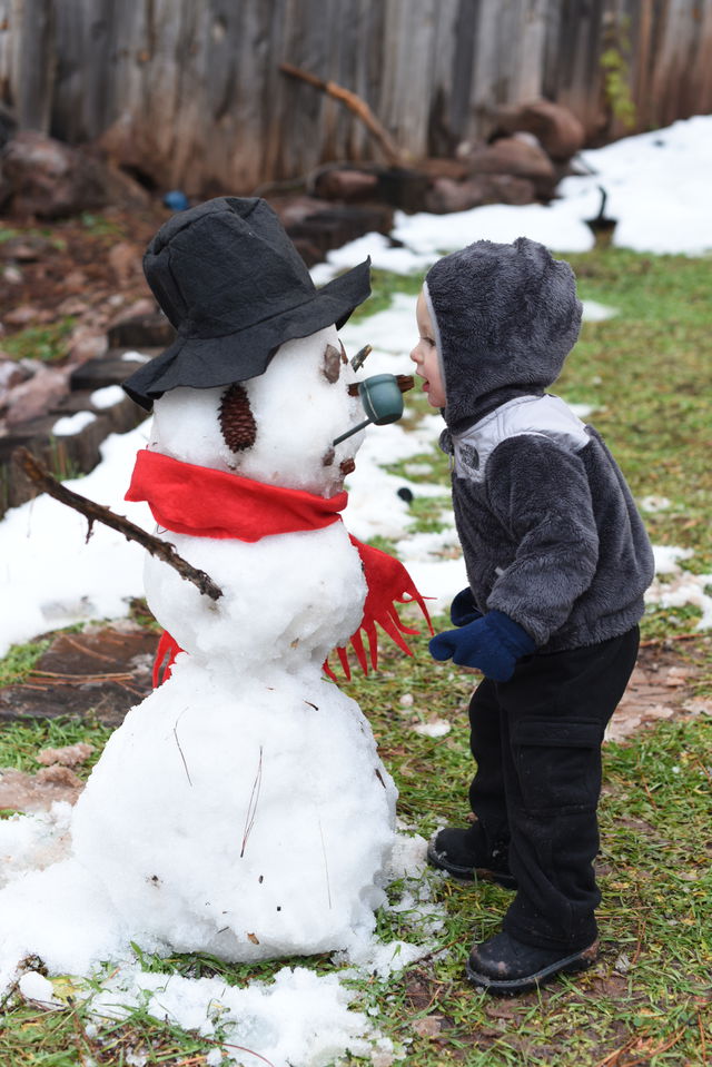 Remy kissing his first snowman