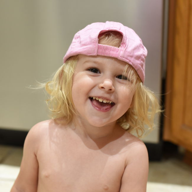Priya in pink baseball cap