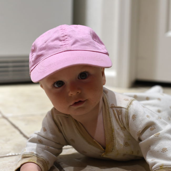 Remy in pink baseball cap
